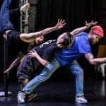 Three performers dance together creating a fluid and dynamic connection between them. These An international group of performers merge hip hop with circus and formed Kundle Cru to develop their first show Blame Game