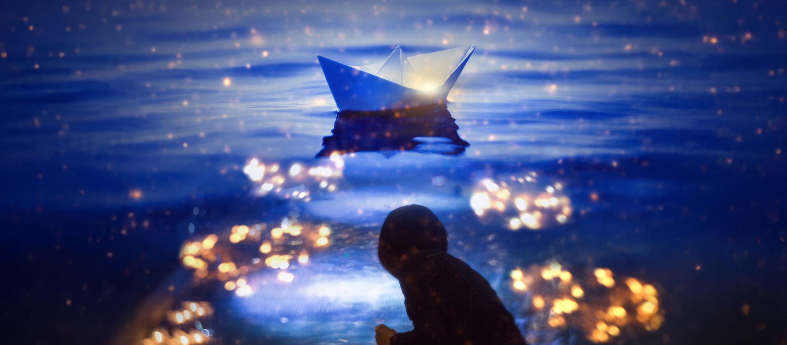 a person silhouetted in the foreground bends to the water's edge in the twilight, there is a paper boat on the water and moonlight, fairy lights dance on the water's surface A Sea of Words for Portsmouth | Over The Ocean | Kingsley Ng (c) Cheung Chi wai Autumn Newsletter upcoming activity