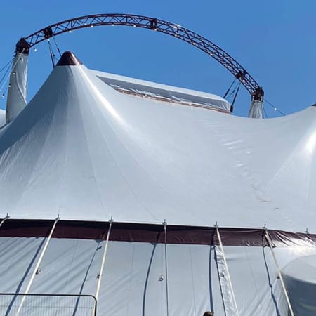 a white 'big top' tent against a blue sky and seascape Artist Inspiration Trip | Ventnor 2024 Artist Breakfast Ventnor Fringe